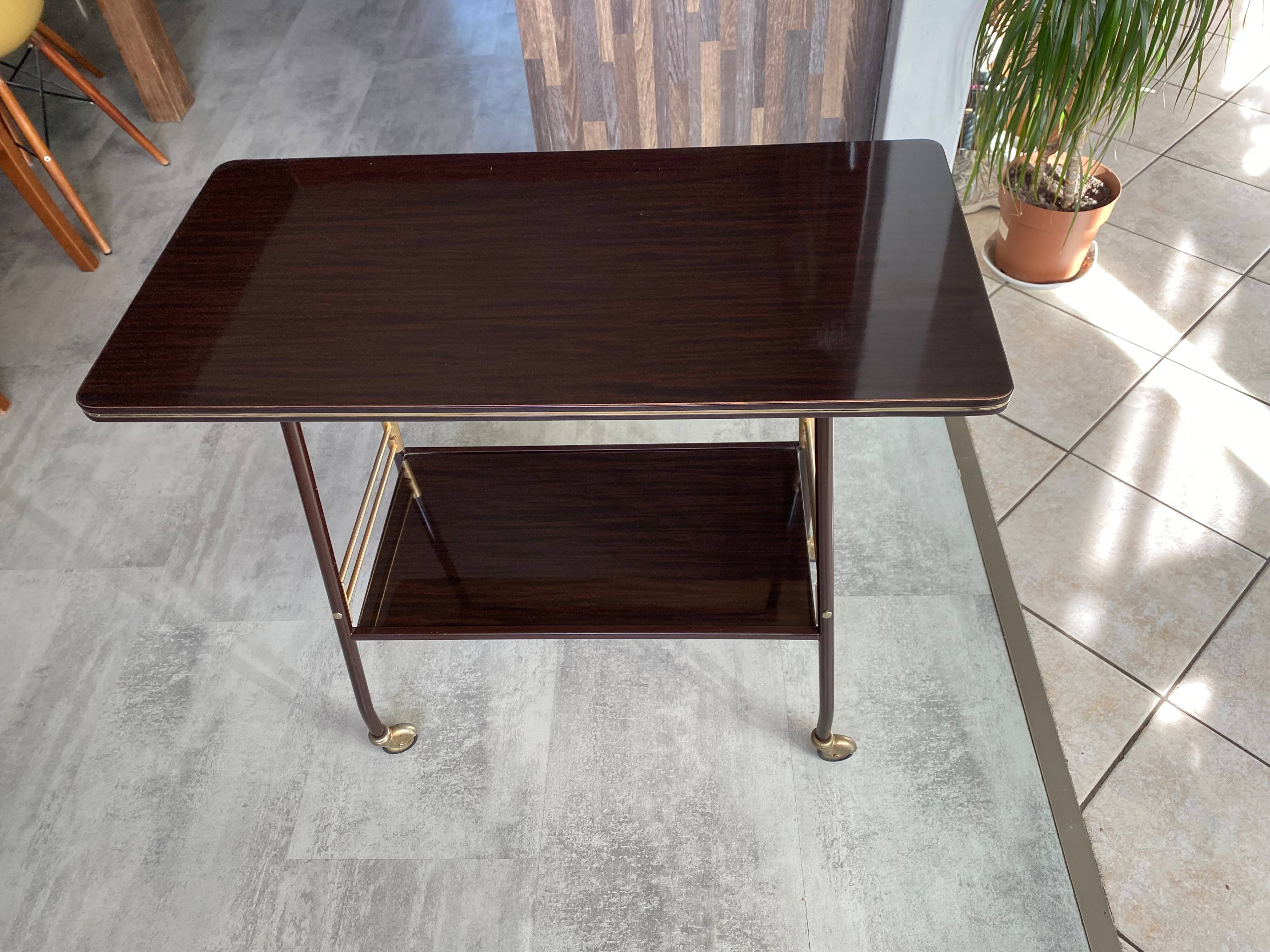 TV stand on casters, 2 brown Formica shelves, 1960s