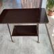 TV stand on casters, 2 brown Formica shelves, 1960s