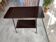 TV stand on casters, 2 brown Formica shelves, 1960s