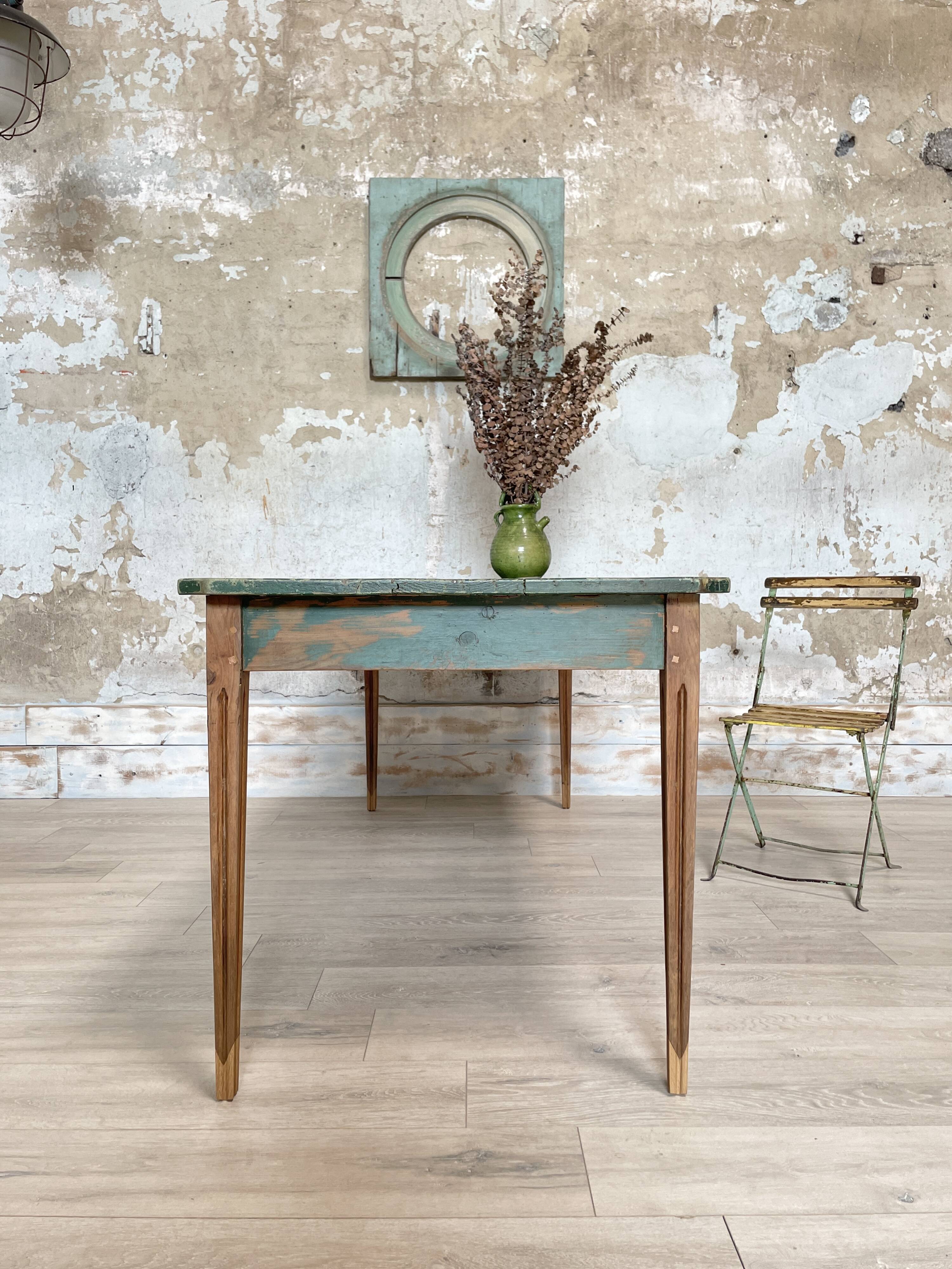 Vintage farm table with spindle legs.