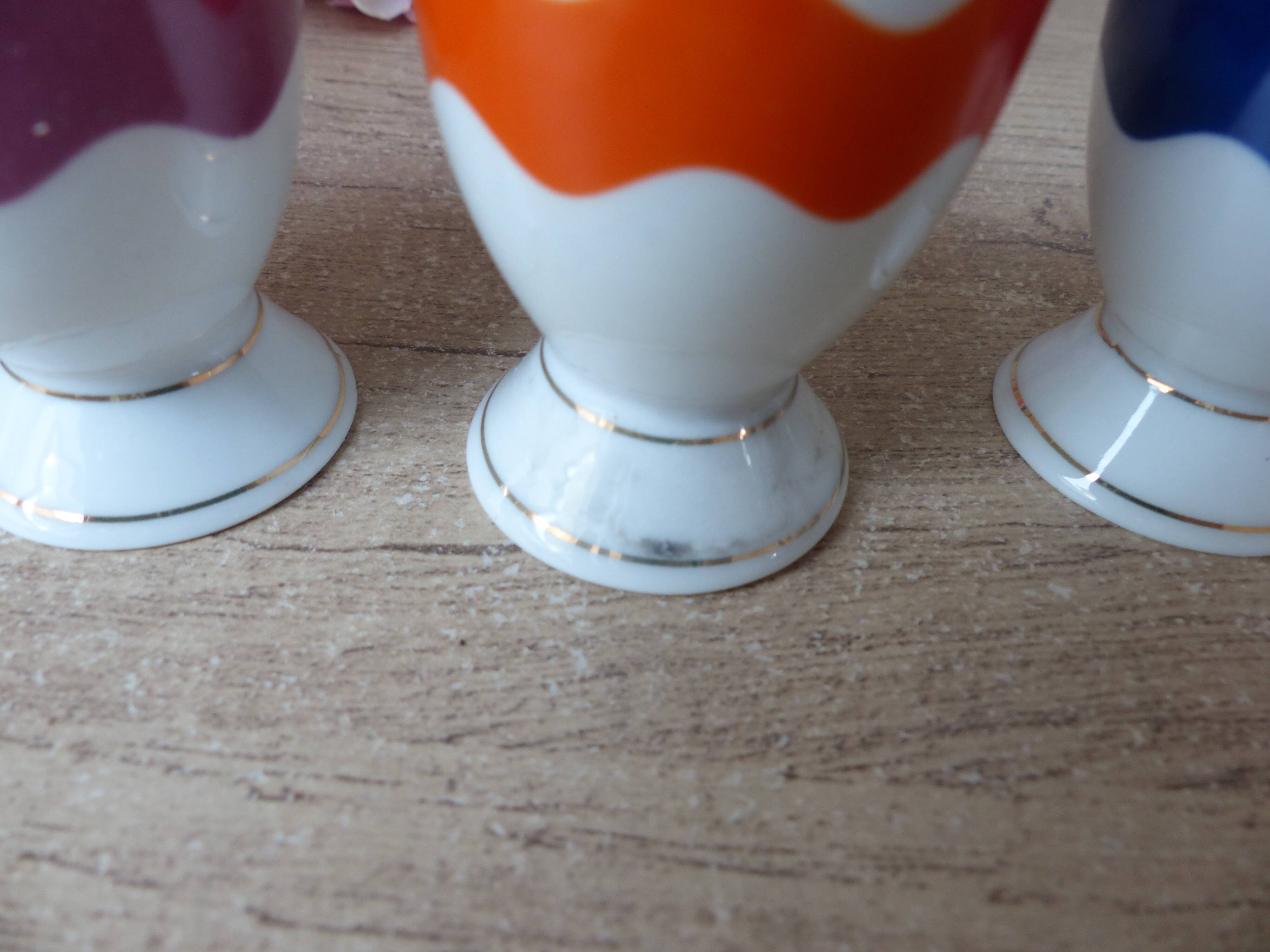 Set of 4 egg cups with spoons, colourful vintage salt and pepper shakers.
