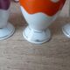 Set of 4 egg cups with spoons, colourful vintage salt and pepper shakers.