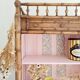 Library, old wooden cabinet imitating bamboo painted in pink