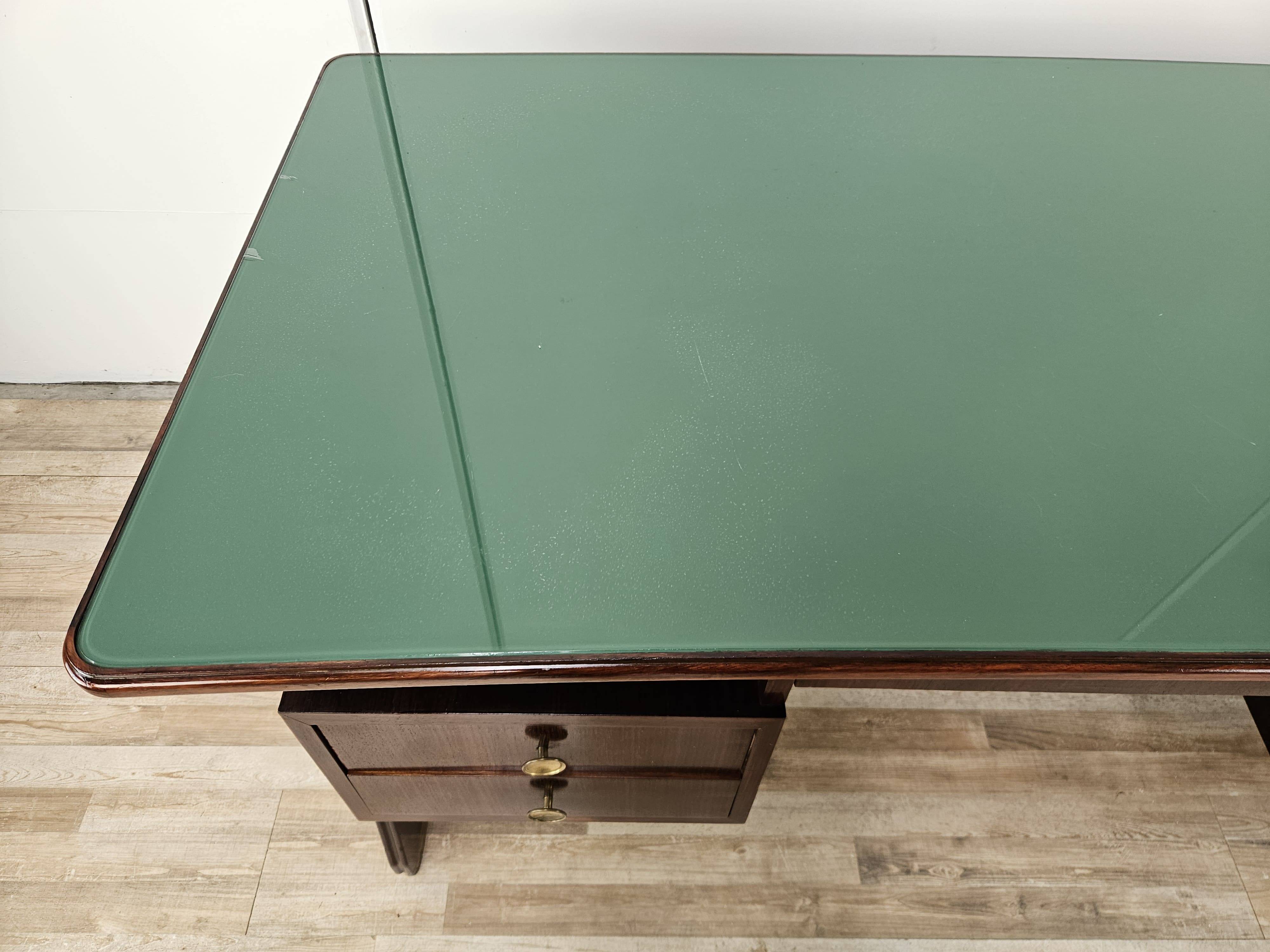 Executive Art Decò desk in exotic wood, glass, and brass