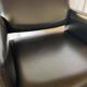 Pair of vintage armchairs in black faux leather and chrome metal.