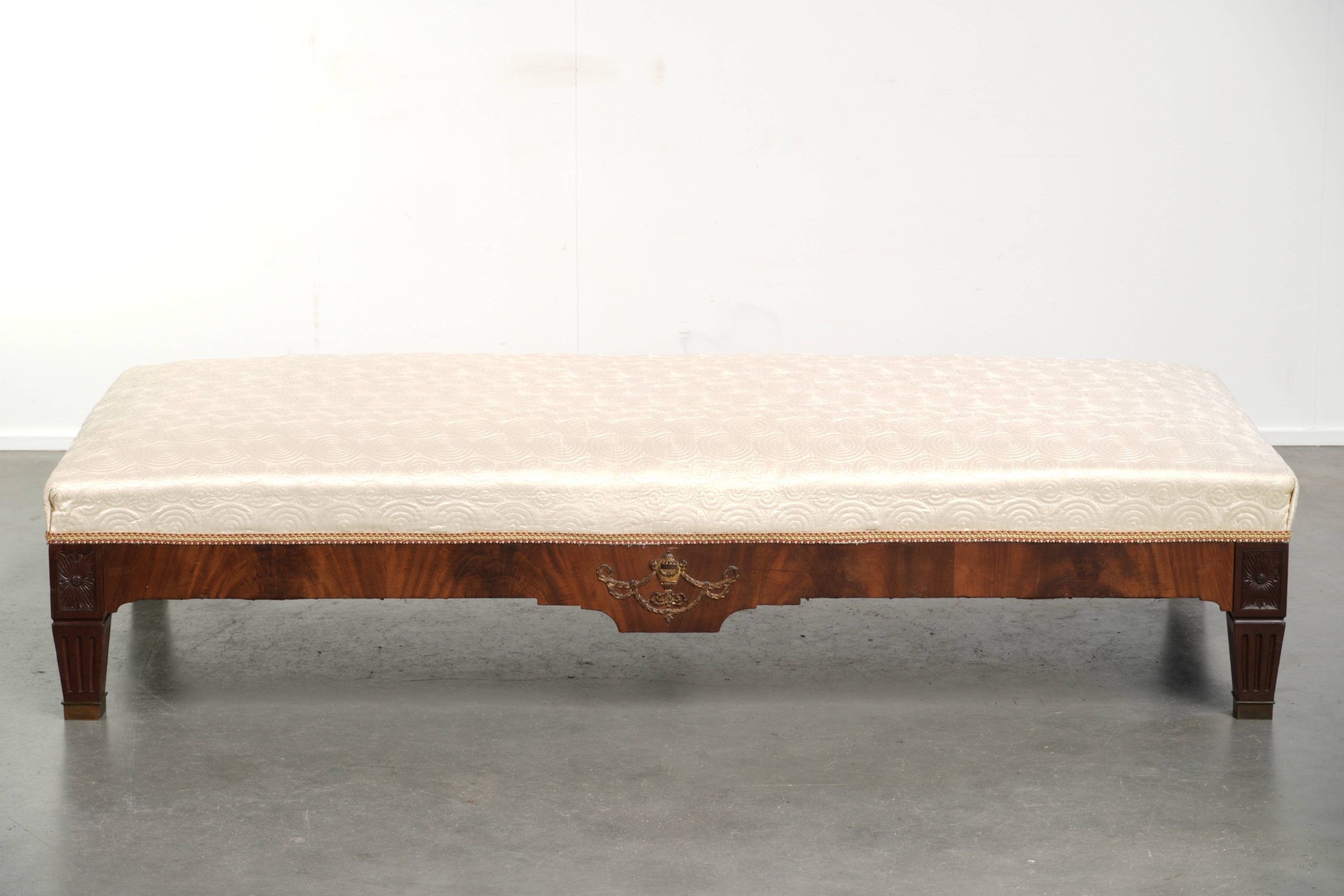 Antique French sofa from the 19th century in Empire style with a silk seat