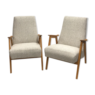 pair of 60s retaped armchairs