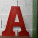Industrial letter "A" in red metal