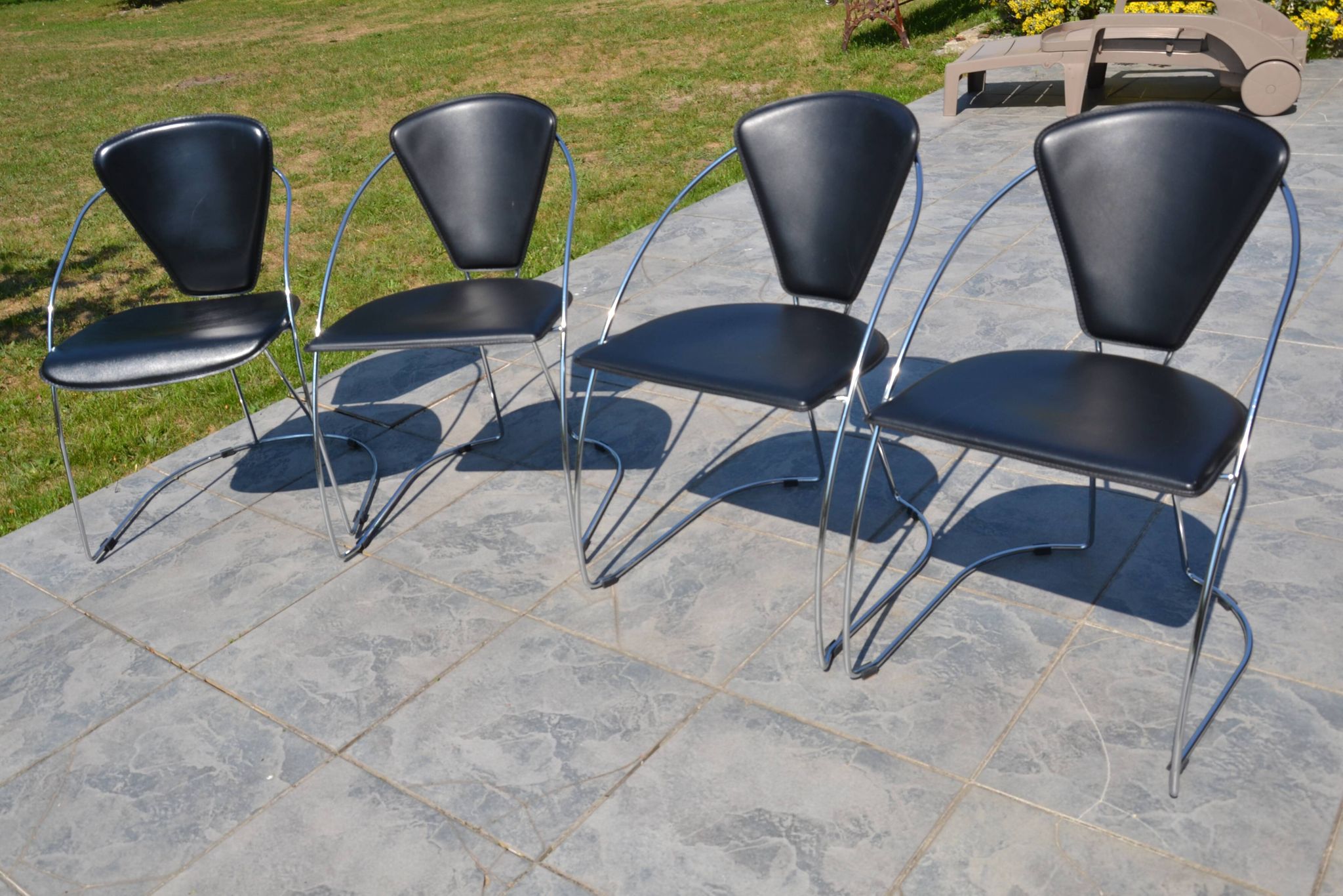4 chrome and leather chairs designed by Italy