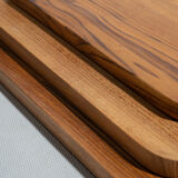 Trio of rounded rectangular trays or cups in monoxyl teak L:35