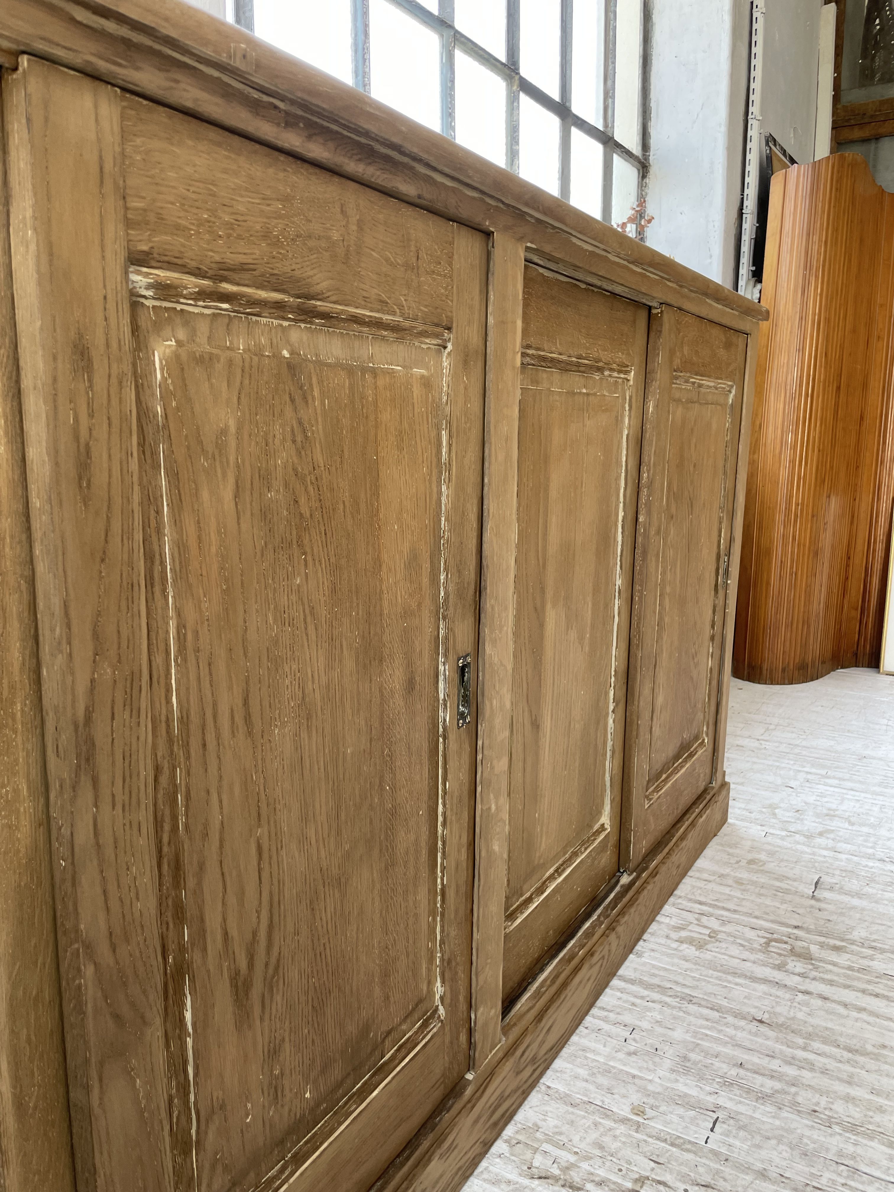 Large row of solid oak loom sliding doors