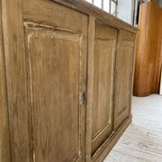 Large row of solid oak loom sliding doors