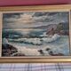 Old oil painting depicting a seascape.