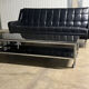 Table basse design vintage chrome et verre fumé noir sur roulettes