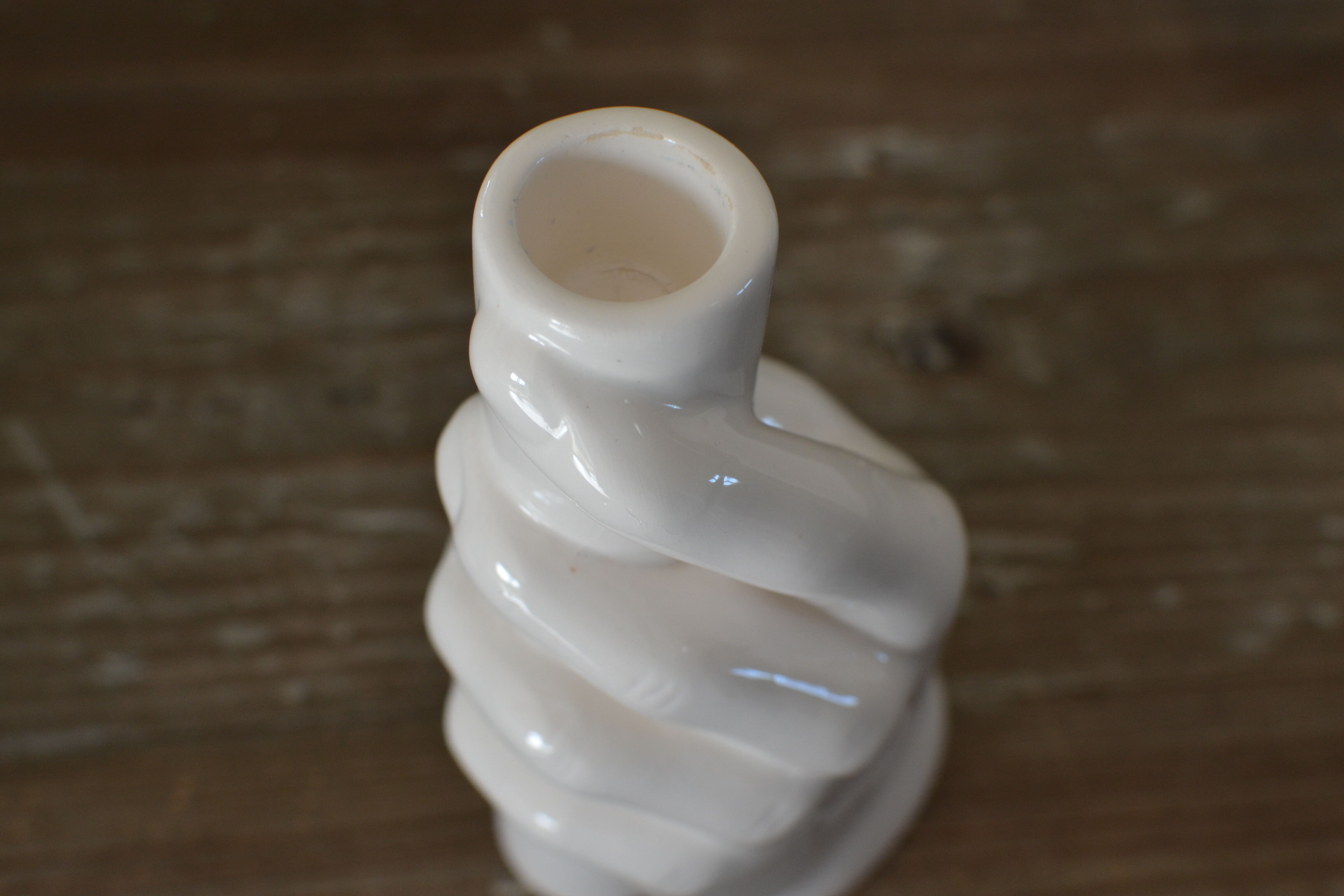 Candle holder for ceramic hand candle