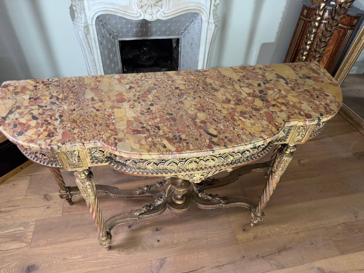 Console with 4 legs from the end of the 19th century in gilded wood in the Louis XVI style.