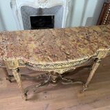 Console with 4 legs from the end of the 19th century in gilded wood in the Louis XVI style.