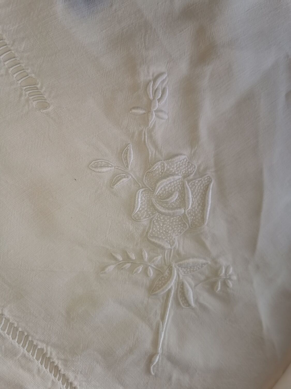 Antique embroidered linen sheet with a monogram.