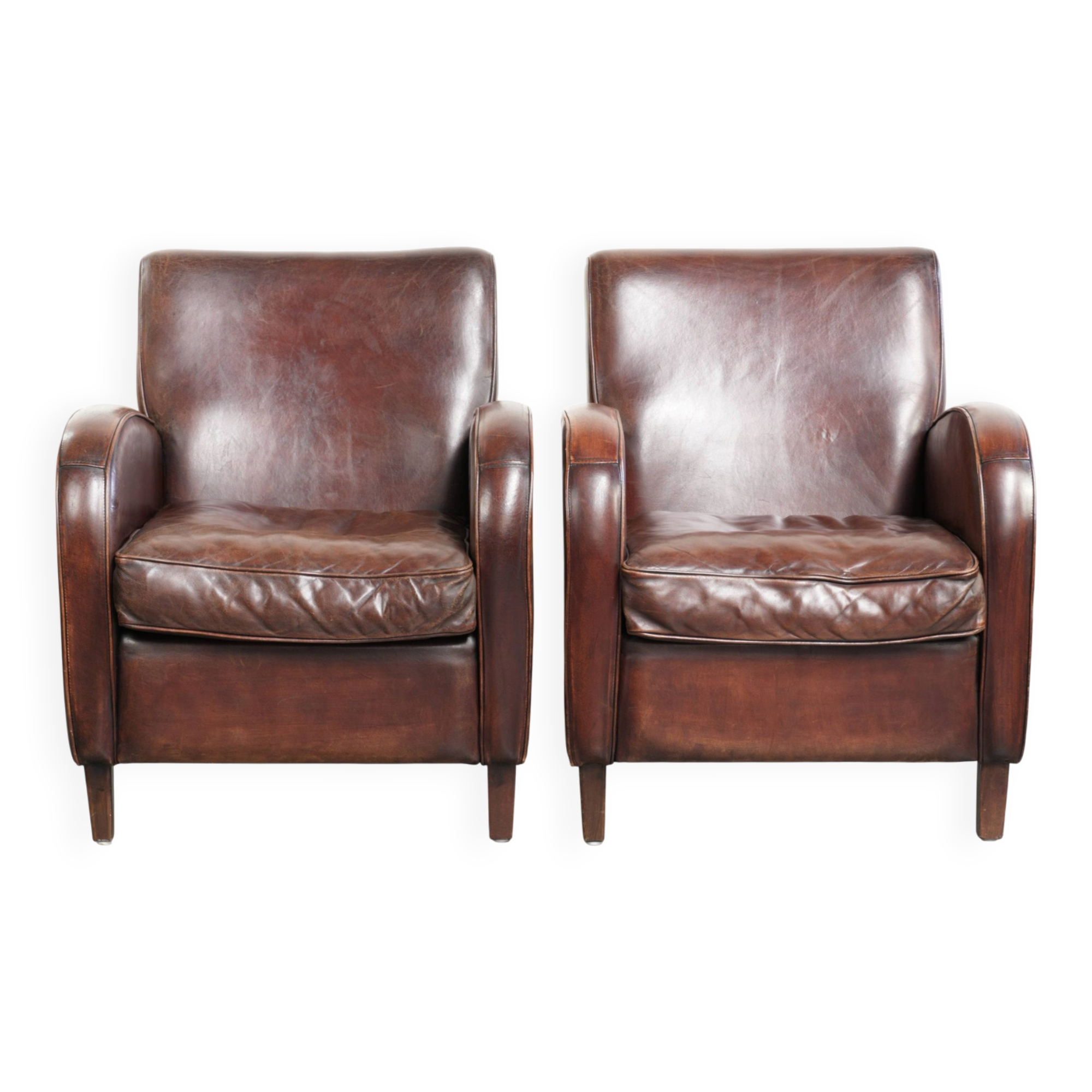 Dark cognac-coloured set of 2 sheepskin armchairs with a sleek design