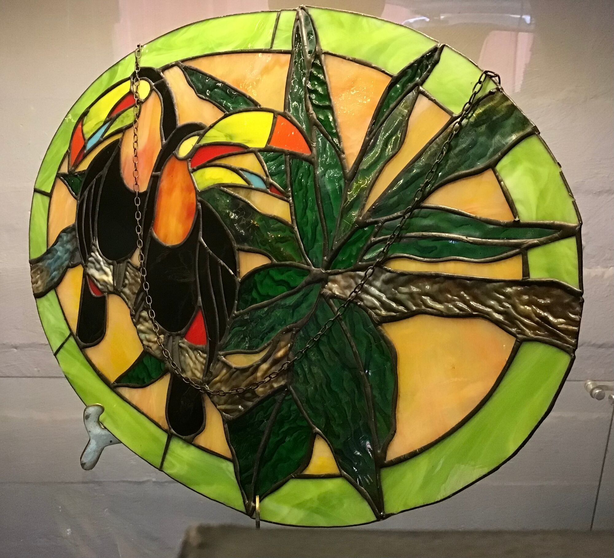 Art Deco style stained glass window representing a couple of toucans