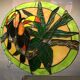 Art Deco style stained glass window representing a couple of toucans