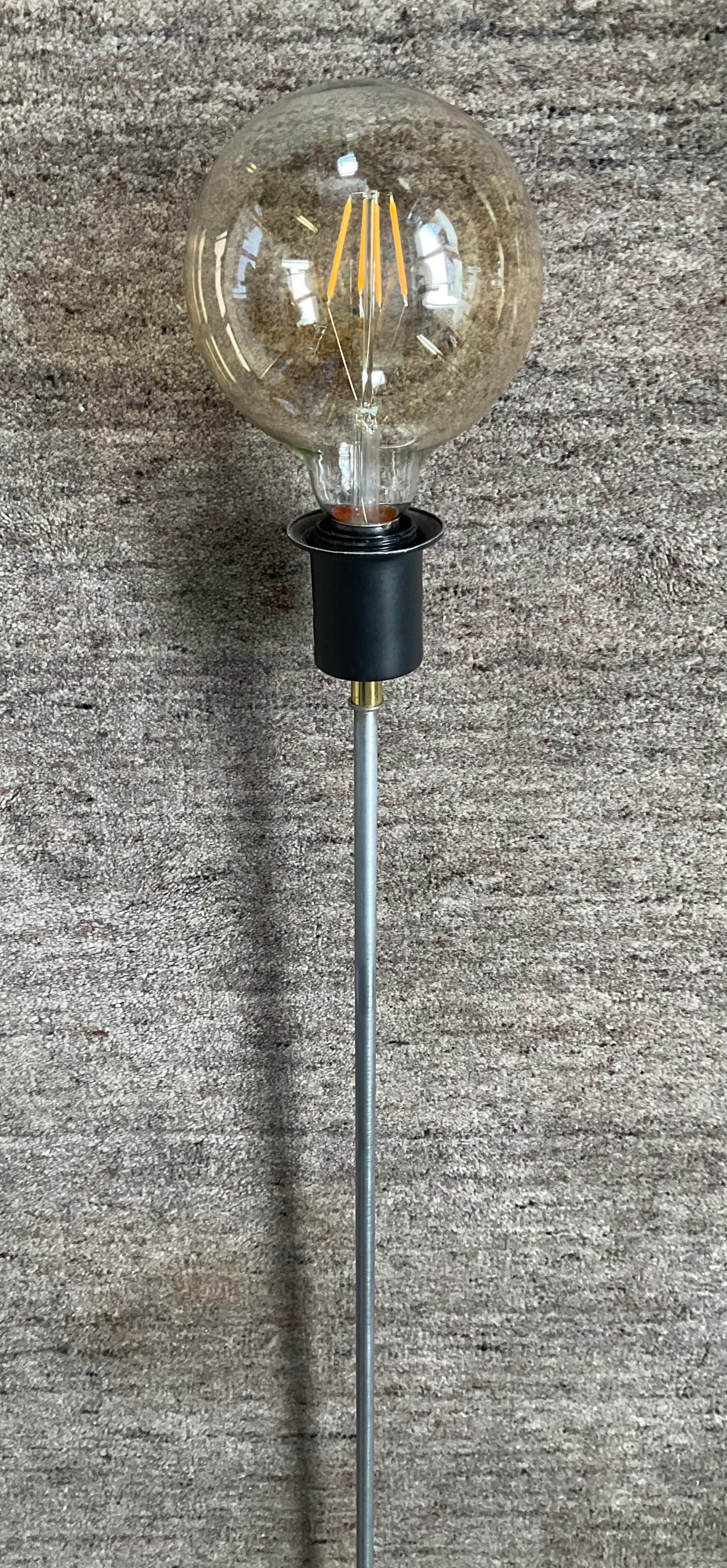 Minimalist floor lamp in cast iron and chrome metal