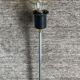 Minimalist floor lamp in cast iron and chrome metal