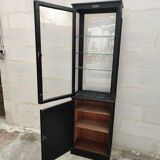 Old wooden window of black patina store two doors