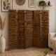 Wooden screen with slats, black plant decoration.