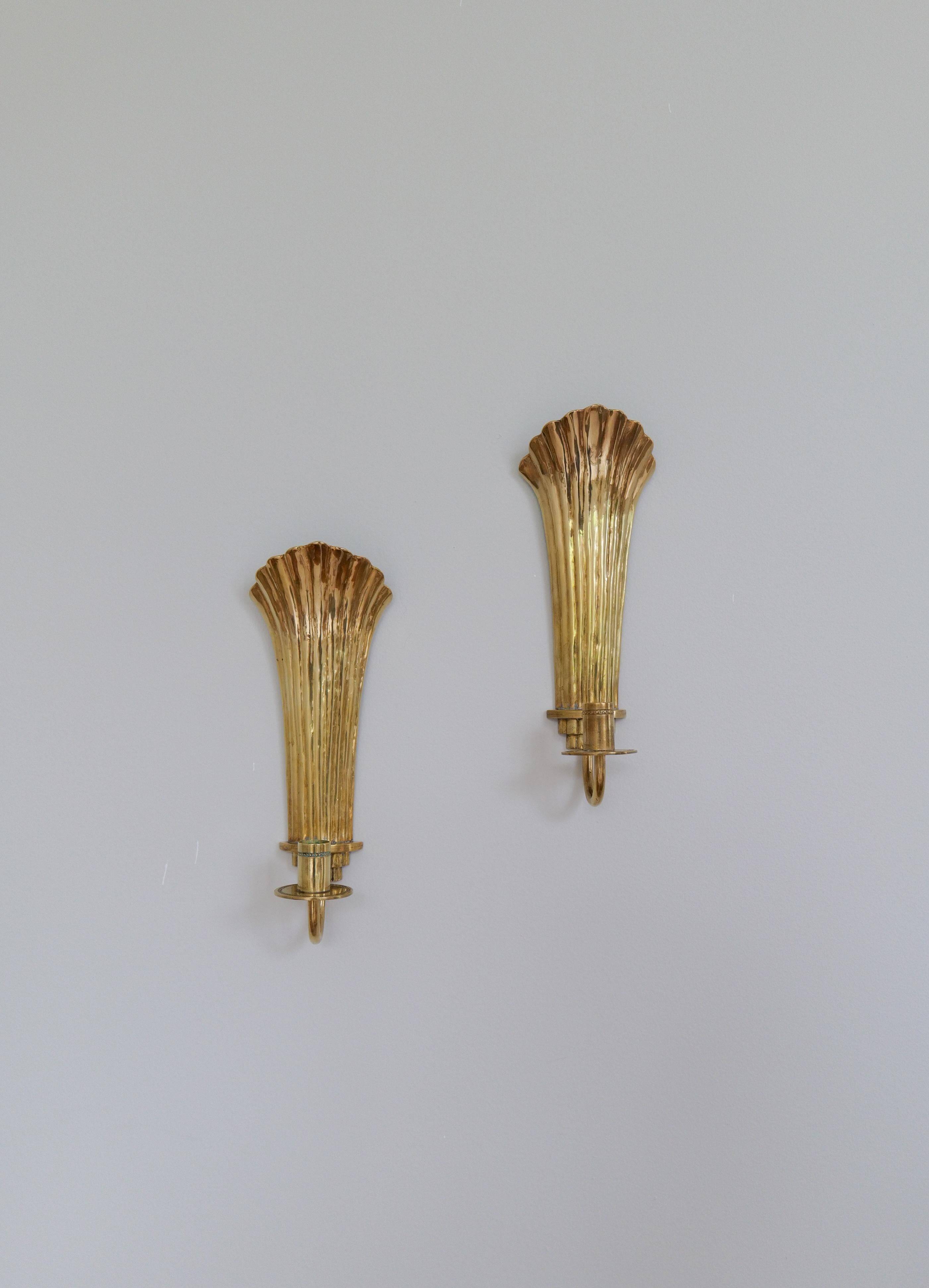 Pair of Art Deco brass wall sconces by Holmström, Arvika, Sweden, 1940s.