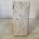 An asymmetrical travertine and fossil bookend.