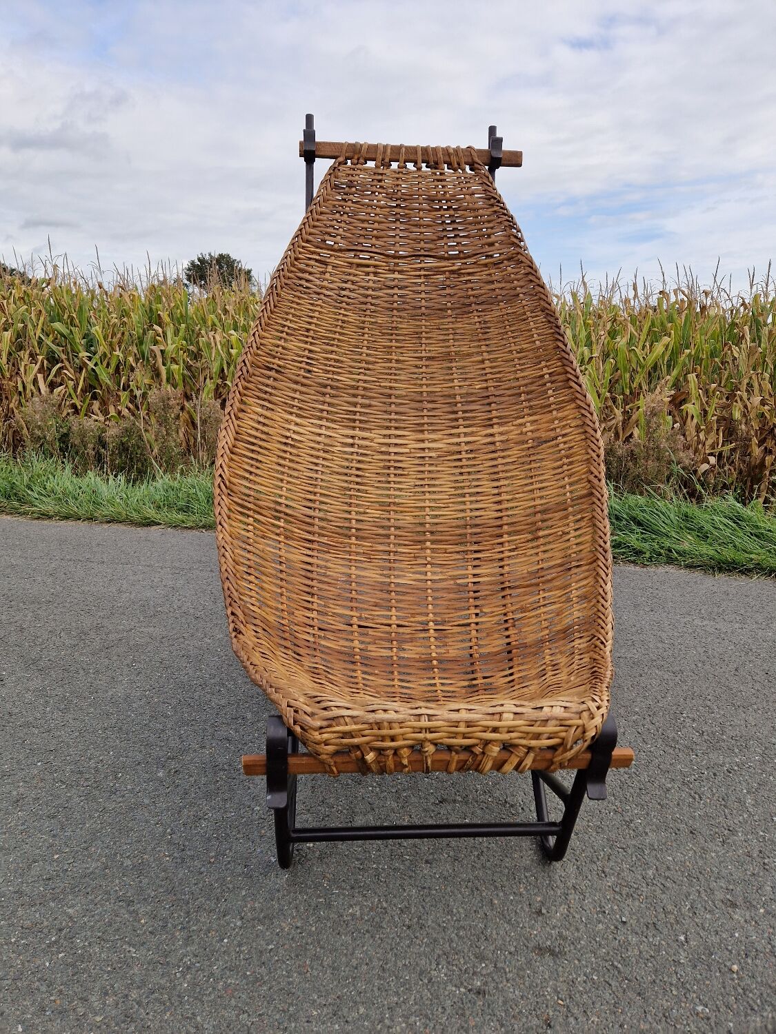 Large vintage metal and wicker armchair