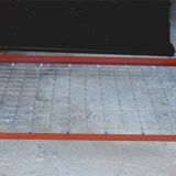 Single bed with wooden headboard and footboard and metal box spring