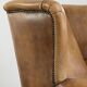 Comfortable cowhide wingback armchair with a timeless English look