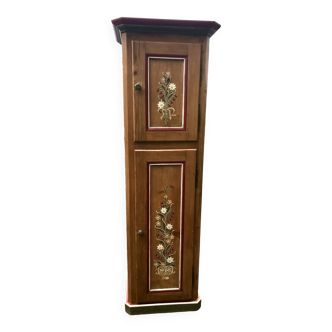 Hand-decorated pine cabinet in chalet style