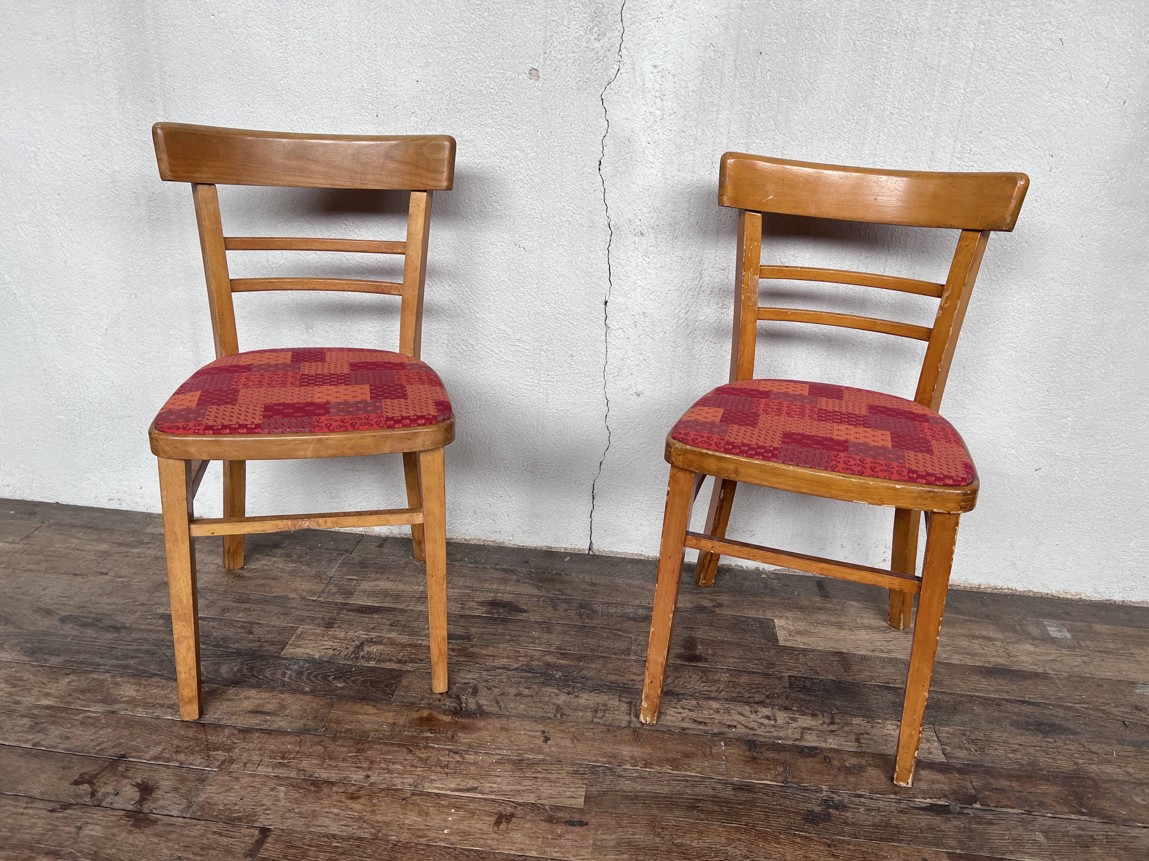 Pair of chairs in light wood and vintage red fabric 1960