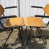 Pair of stackable class armchairs with Bakelite armrests