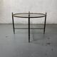 Round coffee table in brass and smoked glass