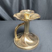 Brass candlestick in a fluted shape from the early 20th century.