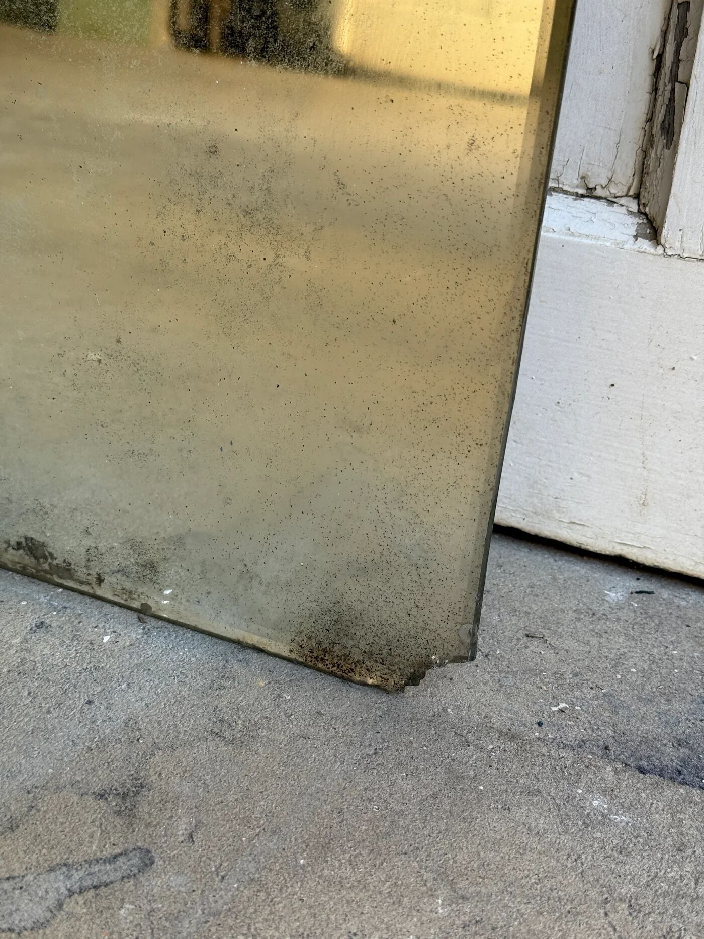 Large vintage mirror with bevelled glass.