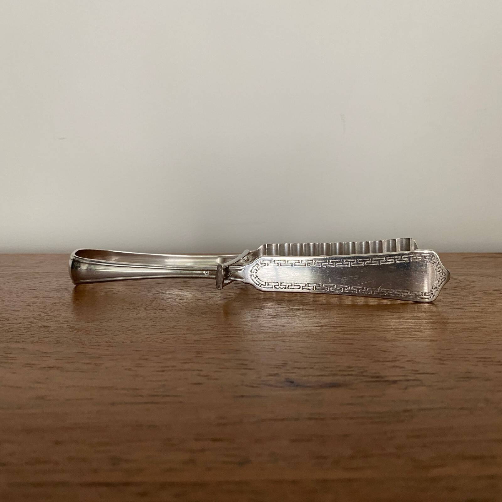 Silver asparagus tongs with Minerva hallmark, 19th century