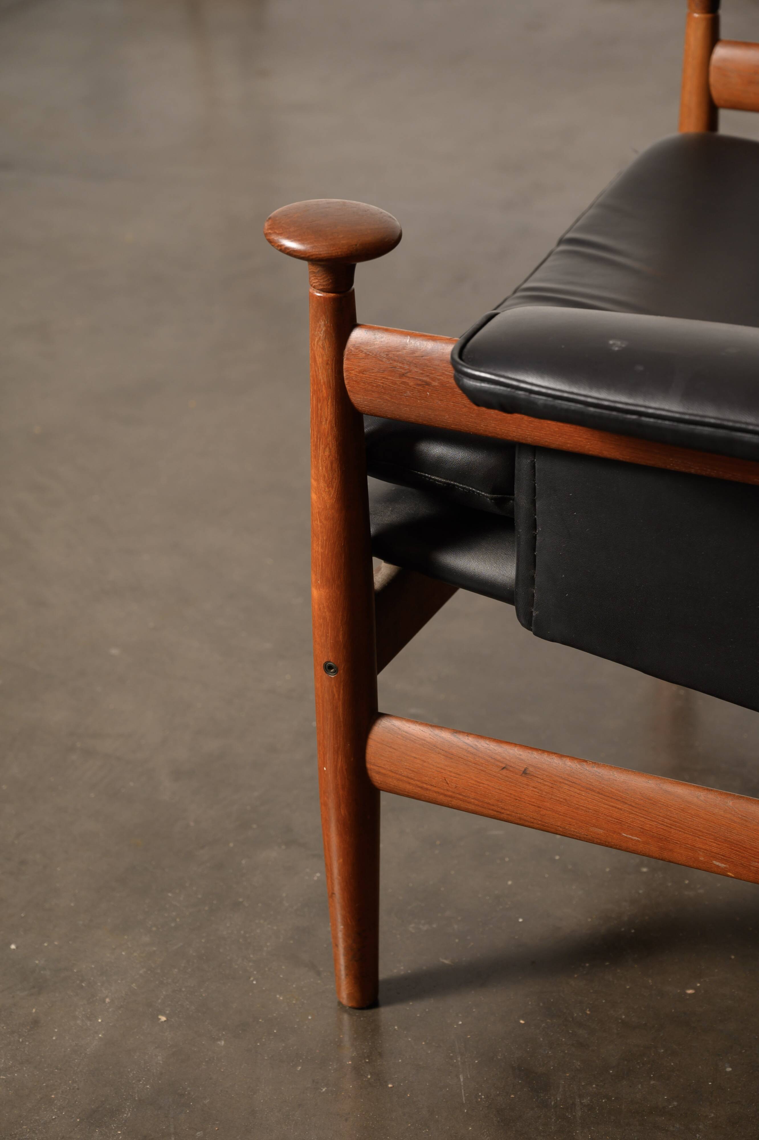 Finished Juhl armchair and its ottoman.