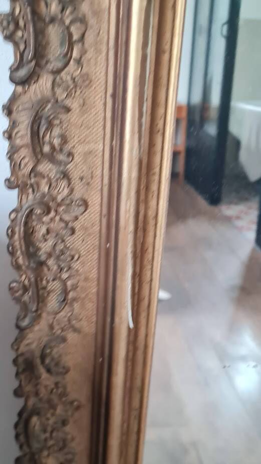 Antique Louis Philippe mirror with a pediment.