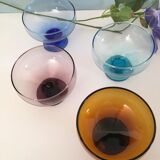 4 cups of different colors in glass