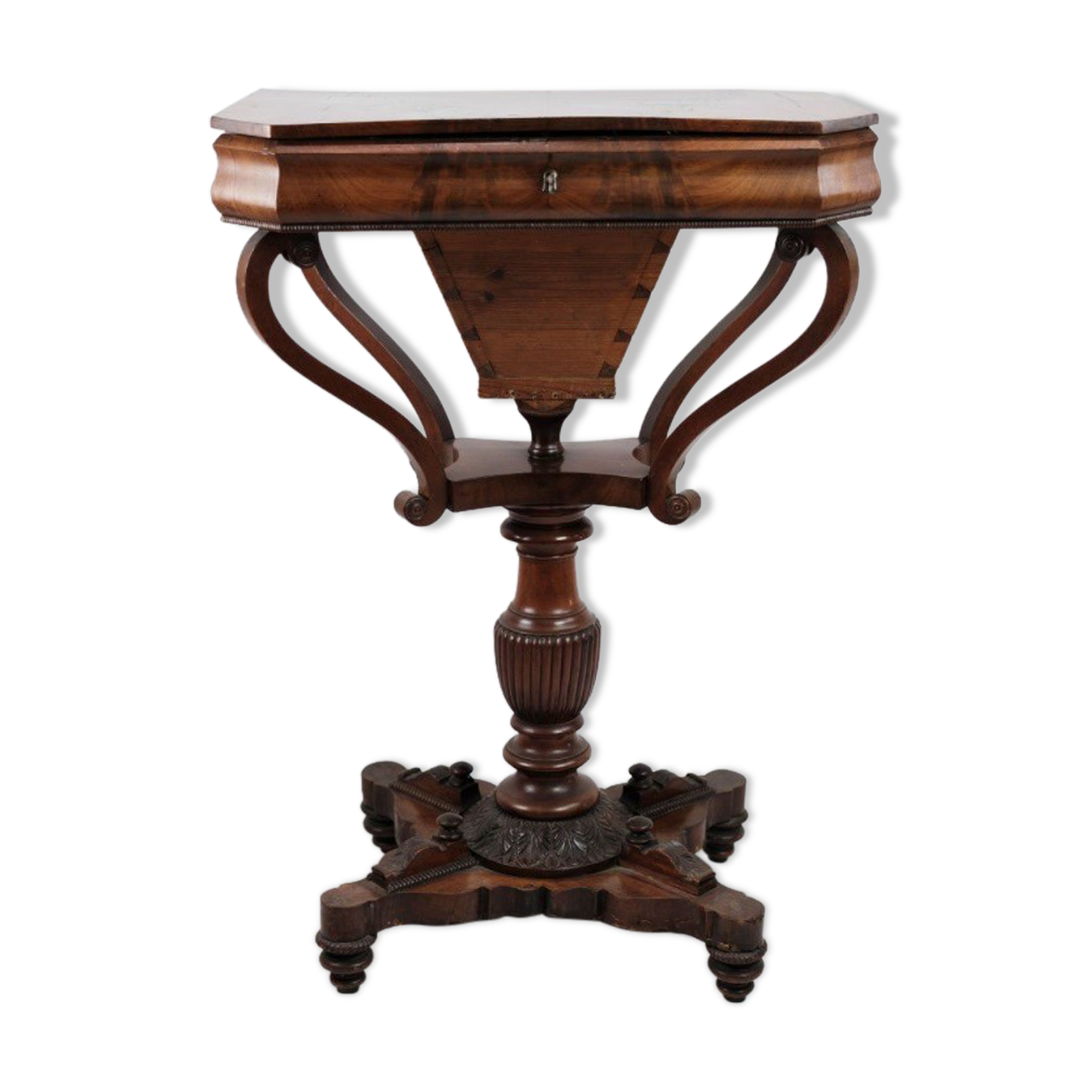 Antique mahogany sewing table on a pillar from around the year 1840s