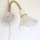 Pair of Scandinavian wall sconces, white and gold metal.