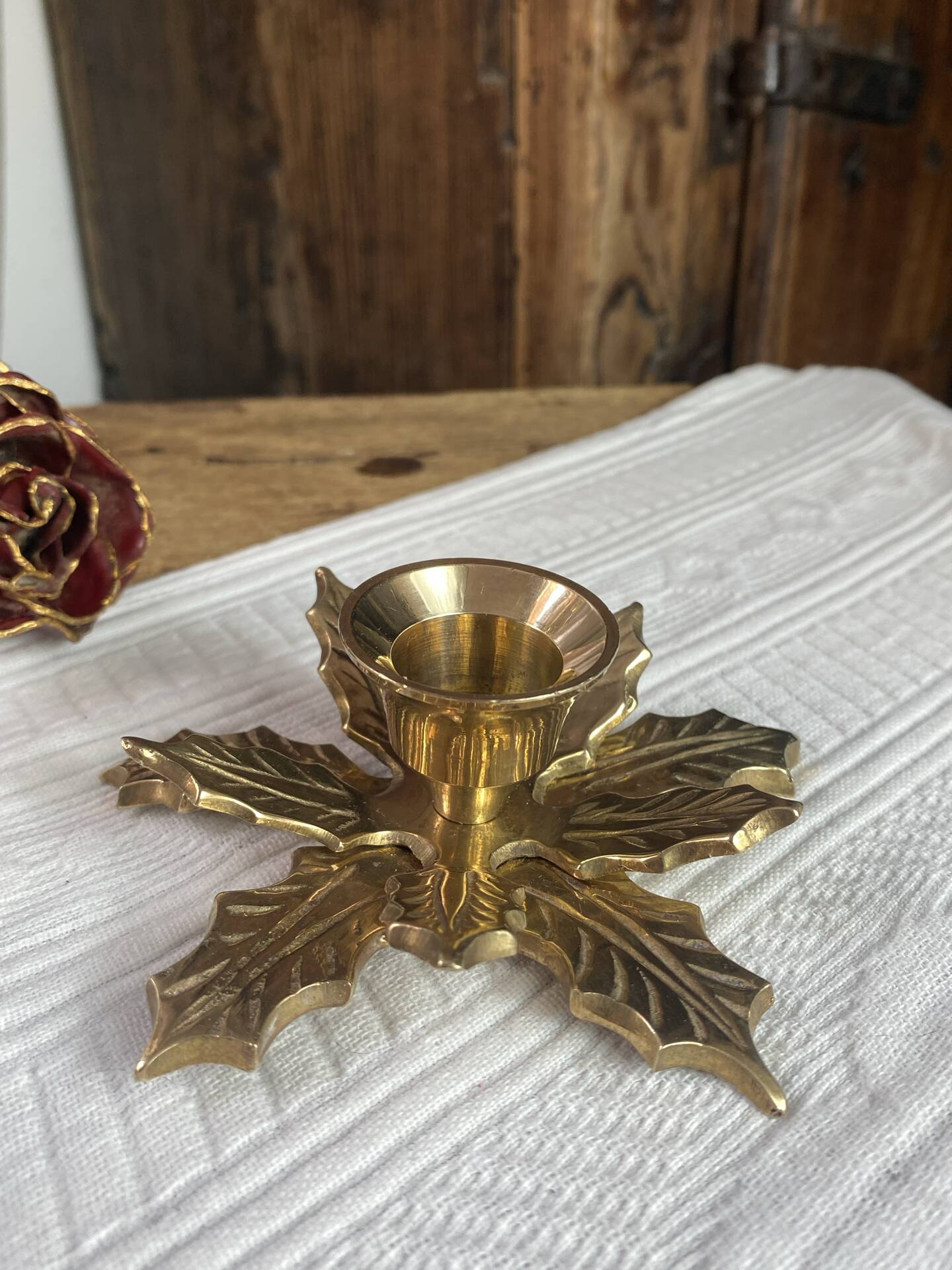 Pair of candlesticks, holly leaves, in brass