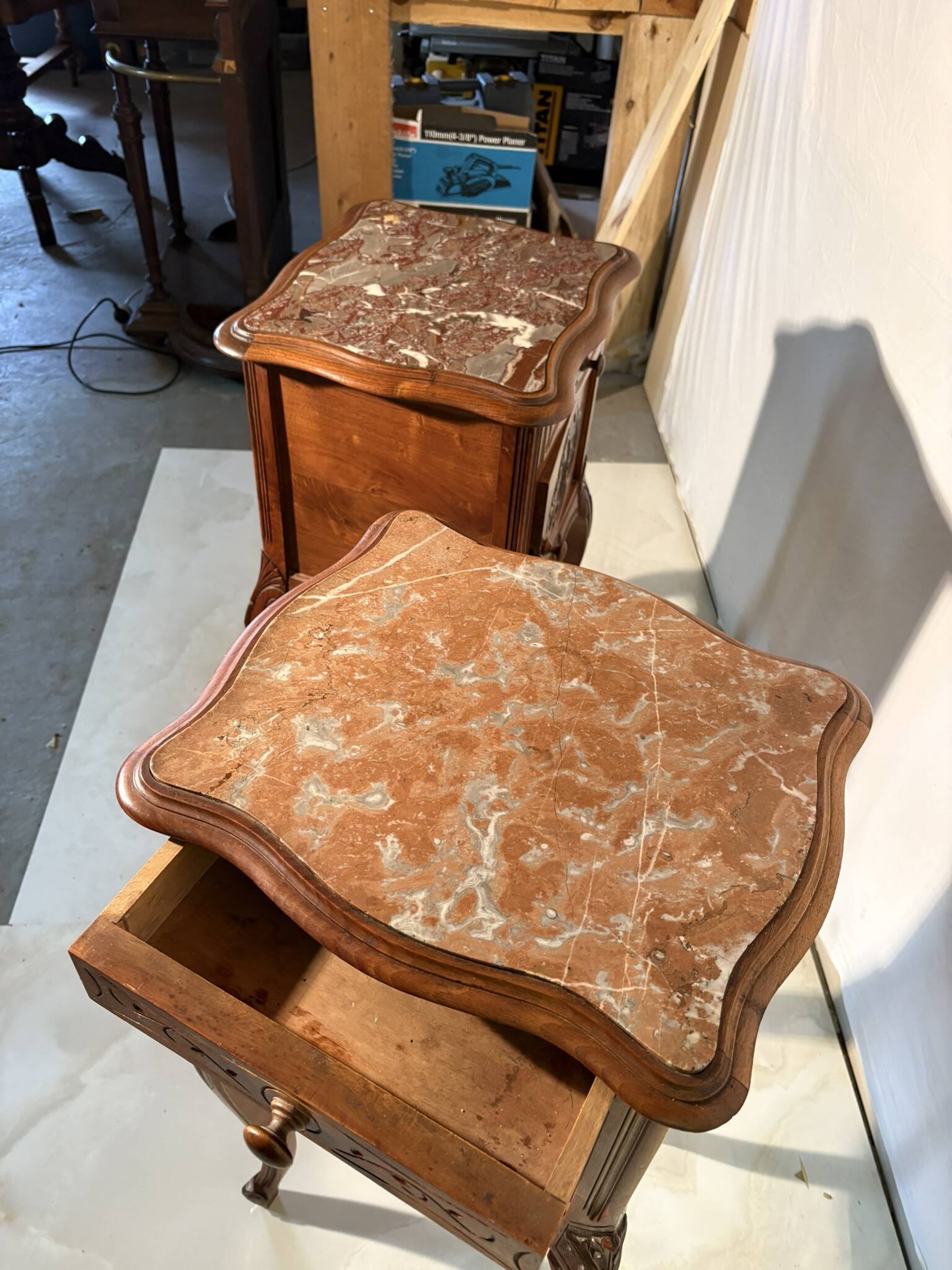 Pair of antique bedside tables with marble top and ceramic niche