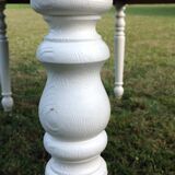 White farmhouse table set and four chairs
