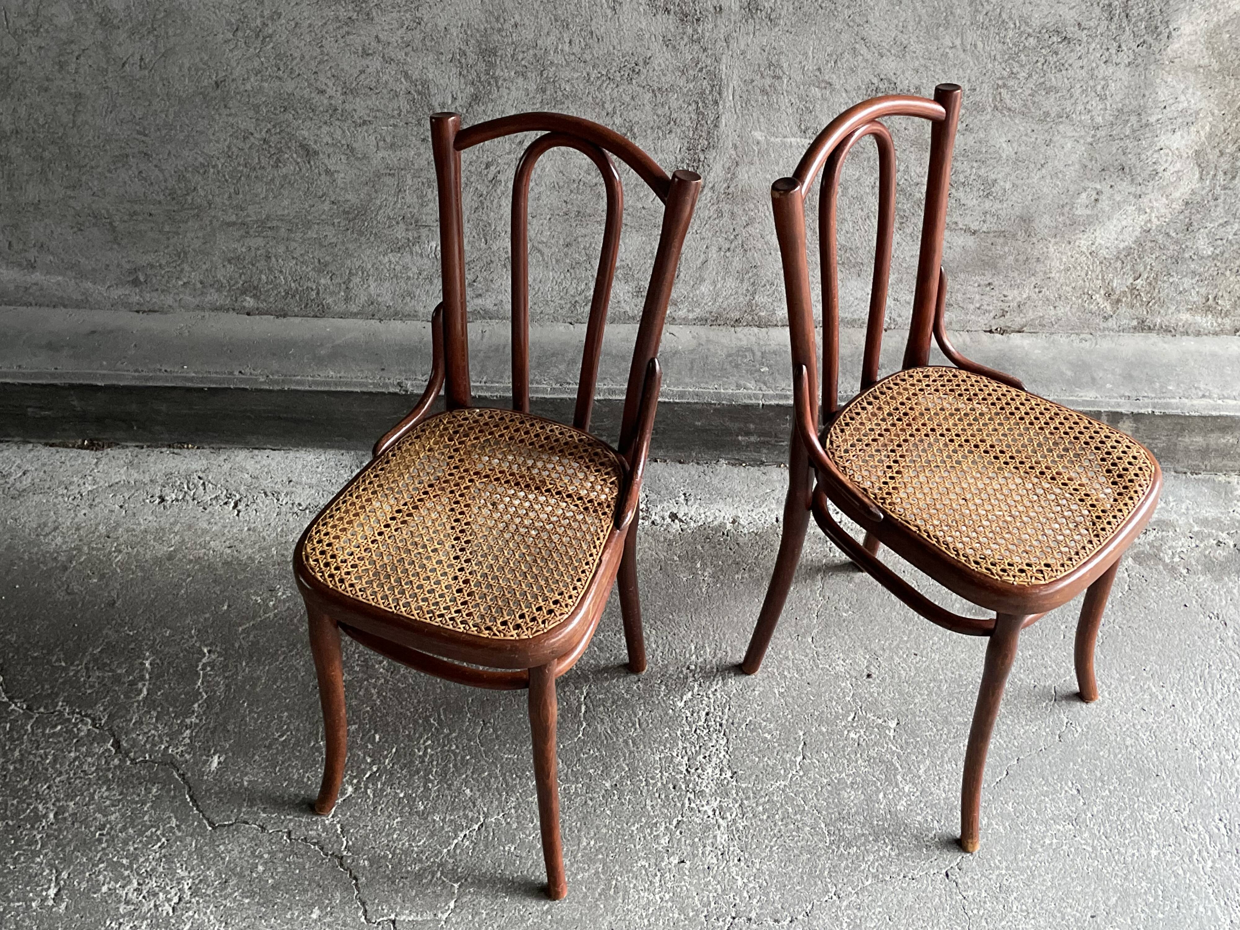 Pair of caned bistro chairs by Thonet